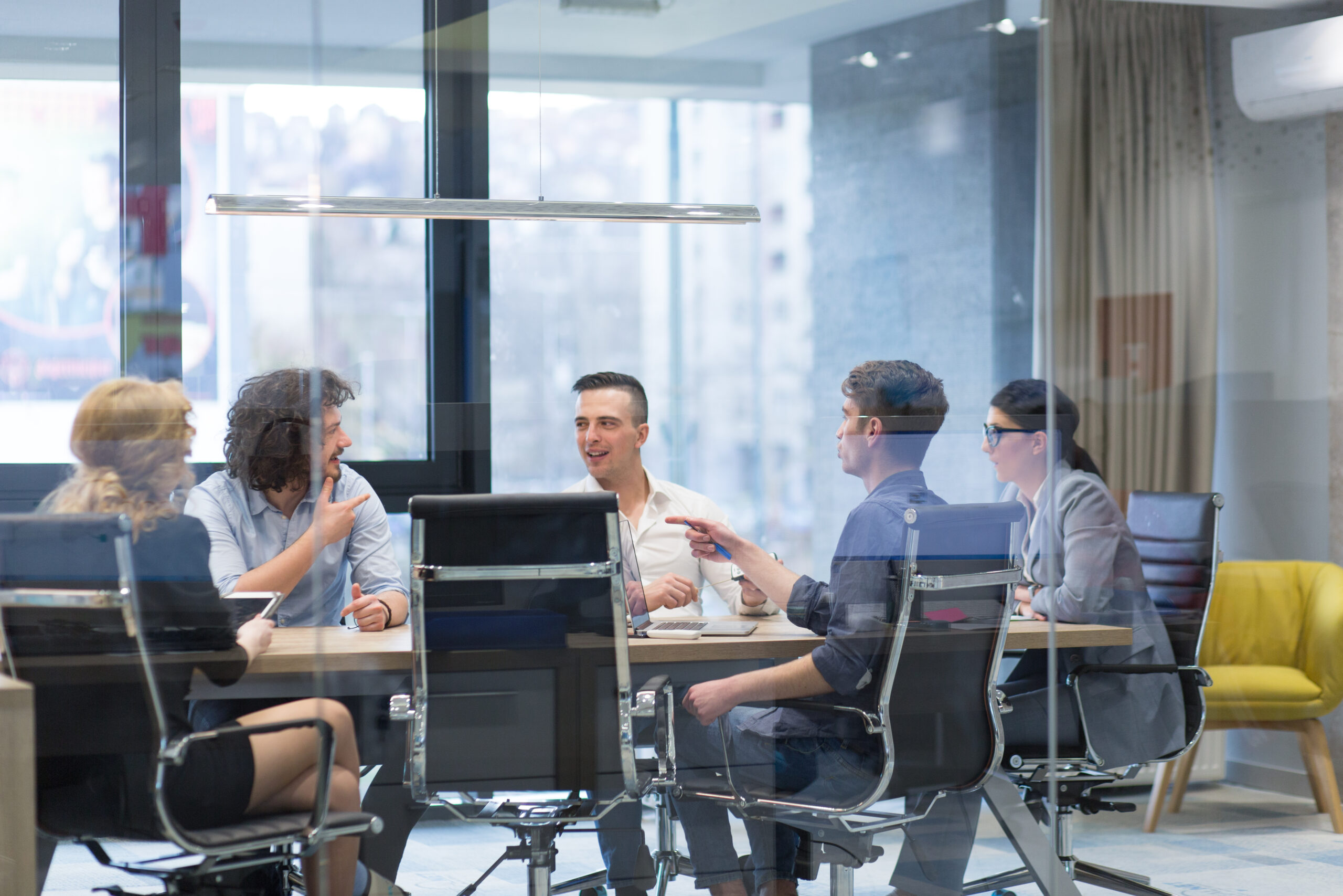 Startup Business Team At A Meeting at modern office building